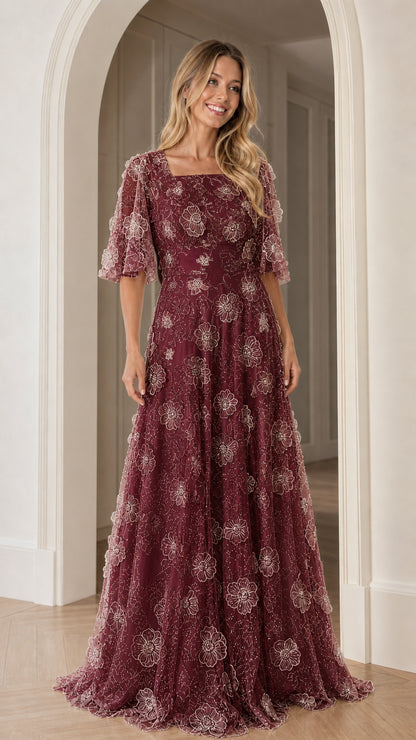 Front view of burgundy floral applique maxi dress