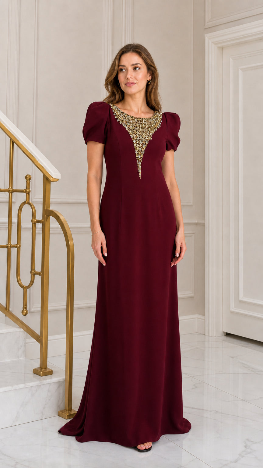 Front view of woman wearing burgundy wine red rhinestone embellished puff sleeve evening gown