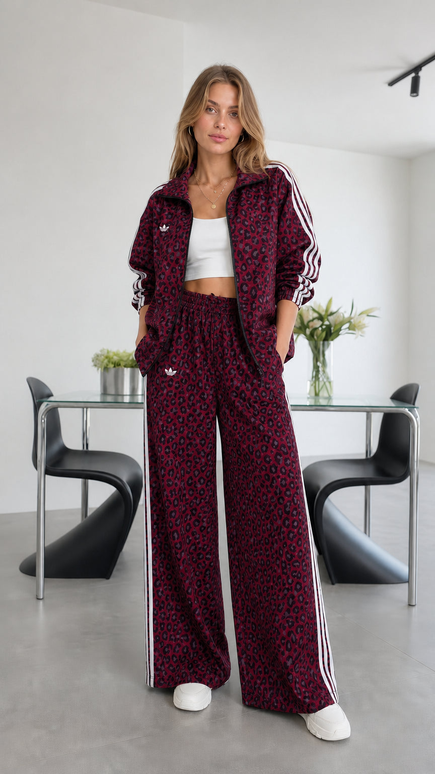 Model wearing burgundy leopard print track set