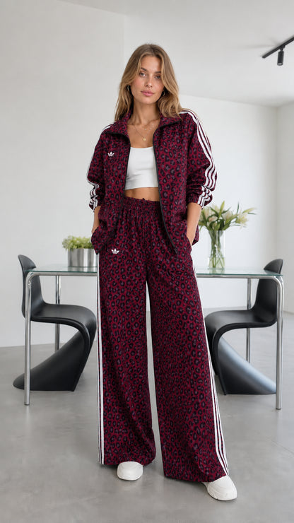 Model wearing burgundy leopard print track set