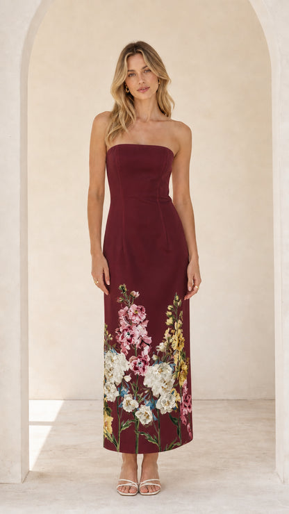 Model wearing burgundy floral strapless midi maxi dress