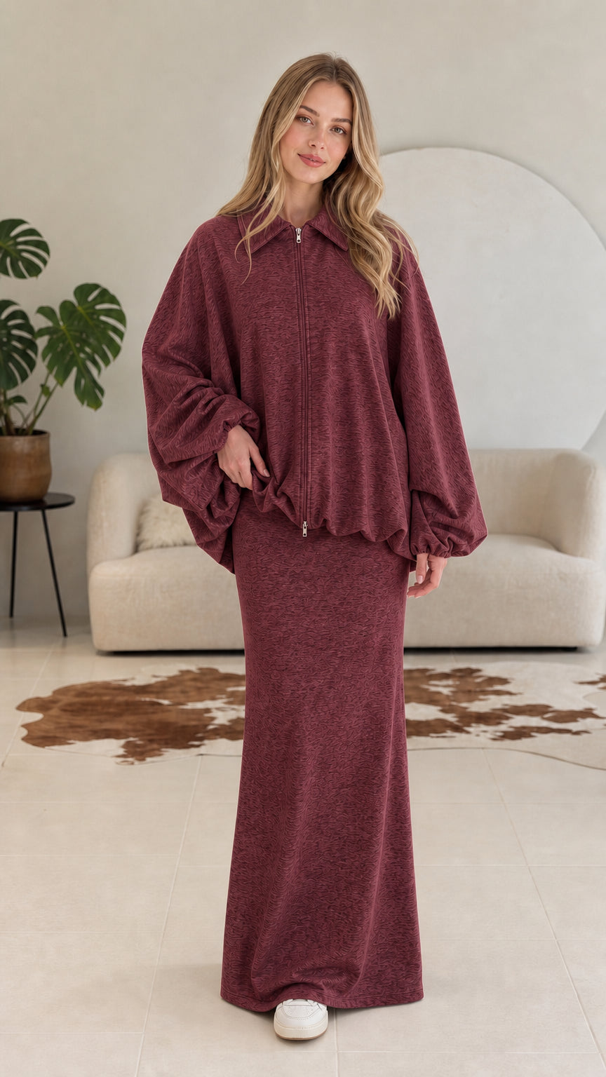 Model wearing burgundy wine two-piece collared zip jacket and maxi skirt set