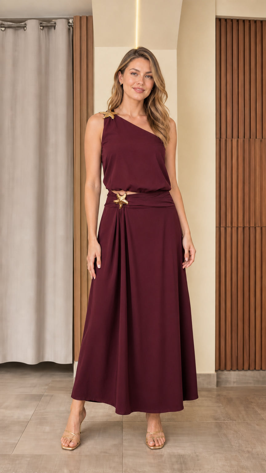 Front view of woman wearing burgundy wine one-shoulder maxi two-piece set