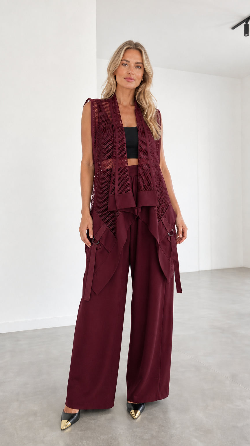 Model wearing burgundy two-piece set