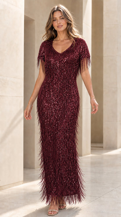Model wearing burgundy sequin fringe evening dress