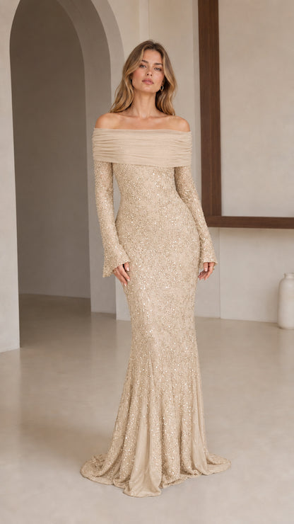 Model wearing champagne off-shoulder sequin evening gown