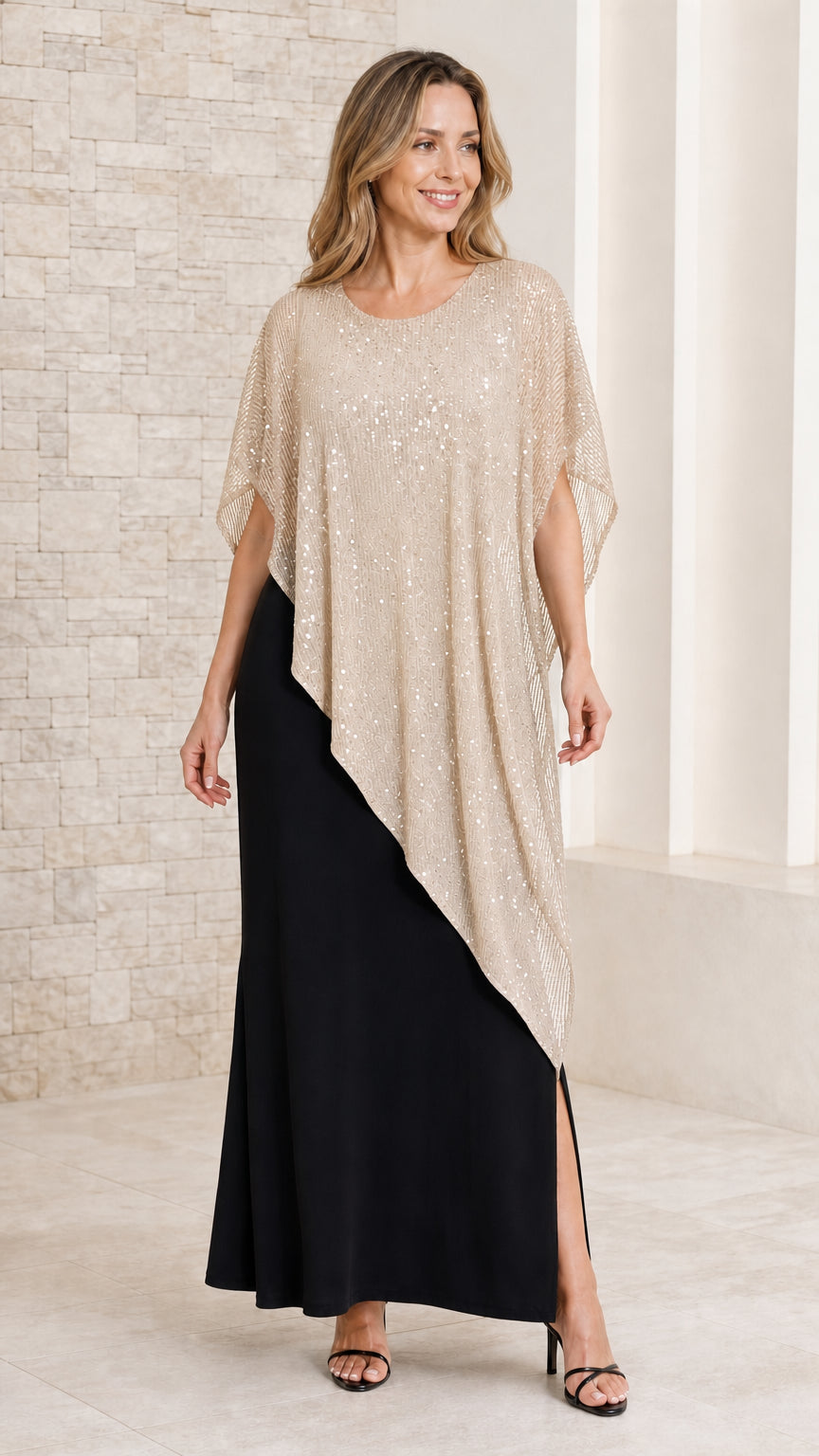 Front view of model in black maxi dress paired with a champagne gold sequined capelet overlay