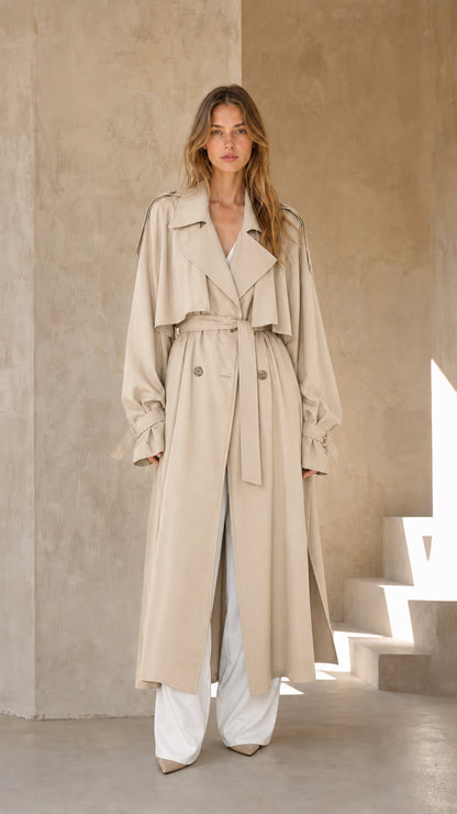 Woman wearing beige long trench coat