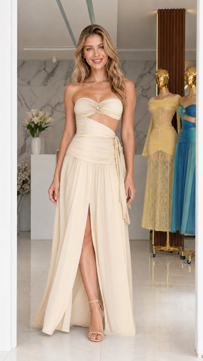 Model wearing beige strapless cutout long dress