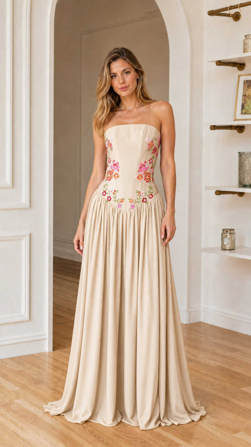 Front view of woman wearing champagne floral embroidered maxi dress