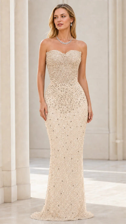 Front view of model wearing champagne beaded strapless mermaid evening gown