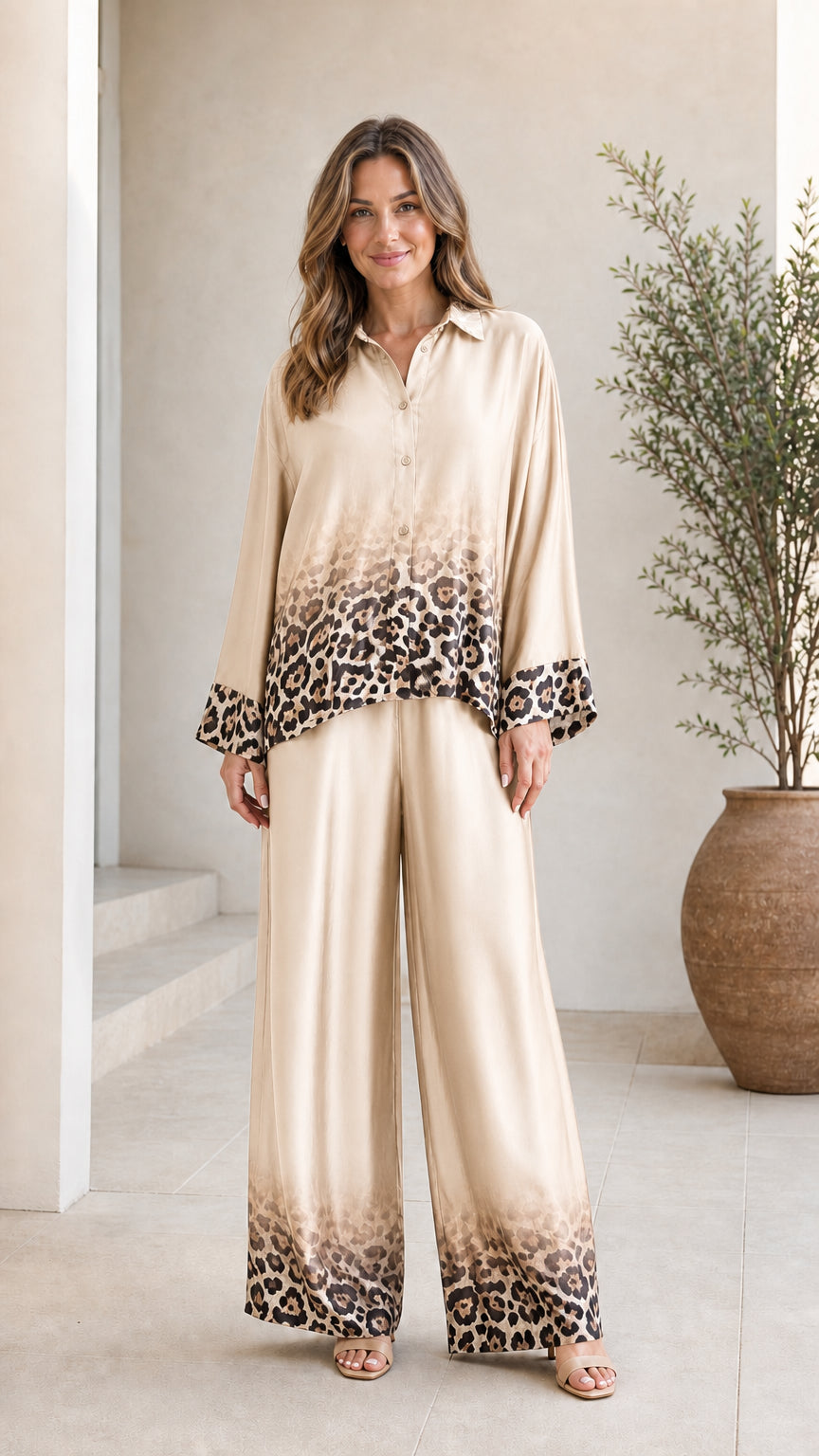 Woman wearing champagne satin leopard ombre pant set