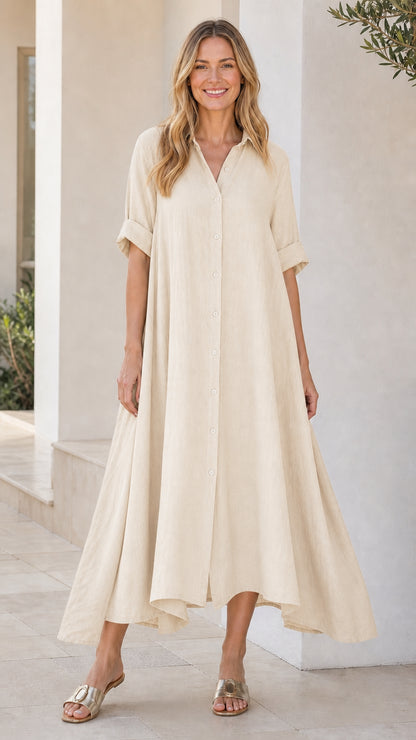 Front view of woman wearing beige button-down midi shirt dress